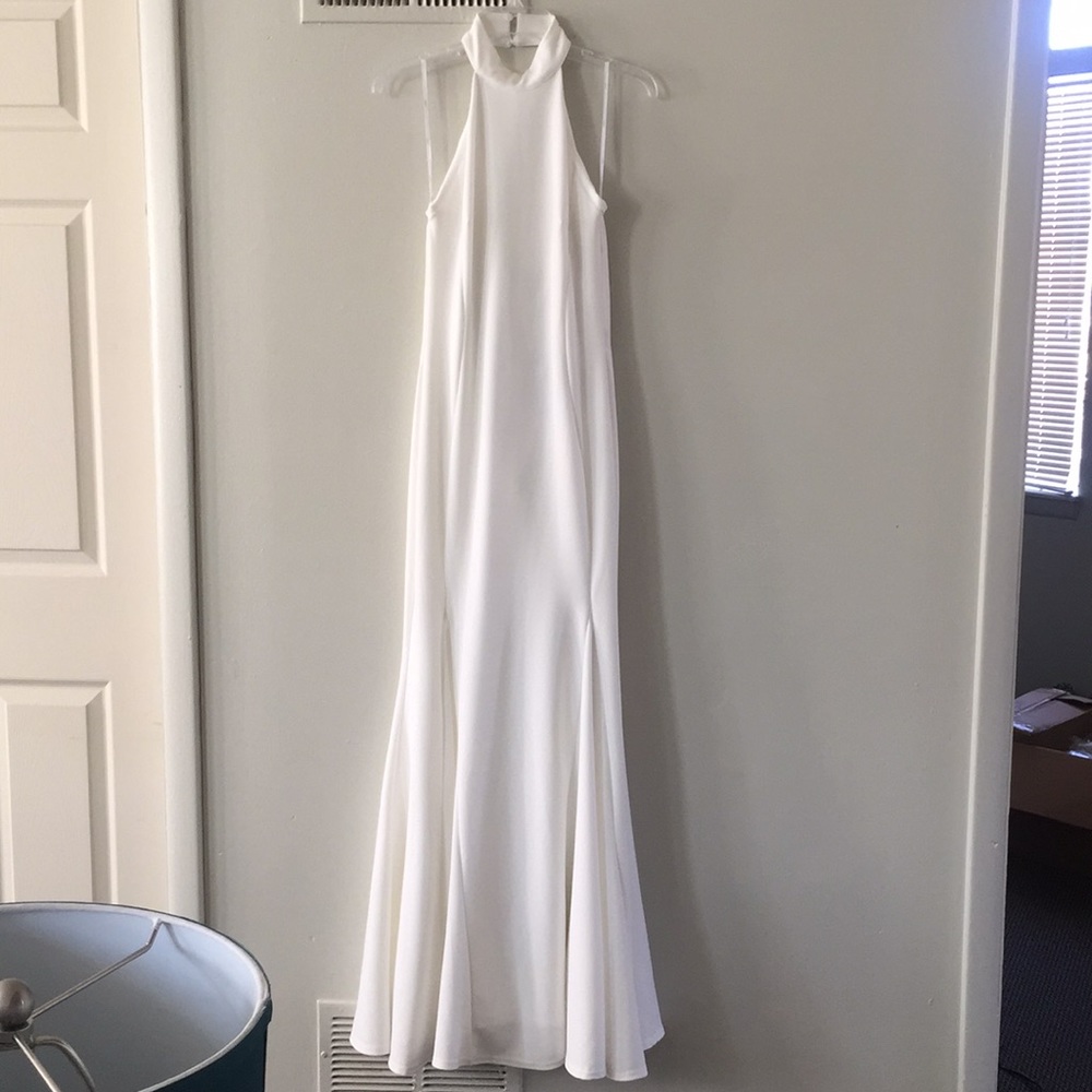 High neck and long white dress.